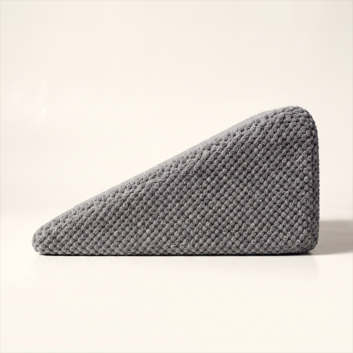 Side elevation of the Doxie Guard stair wedge showing its tapered right-triangle profile