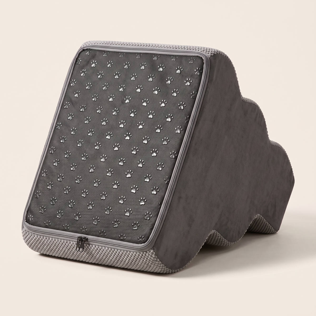 The anti skid base of the Doxie Guard pet stairs, grey woven panel with embossed paw prints and a perimeter zip