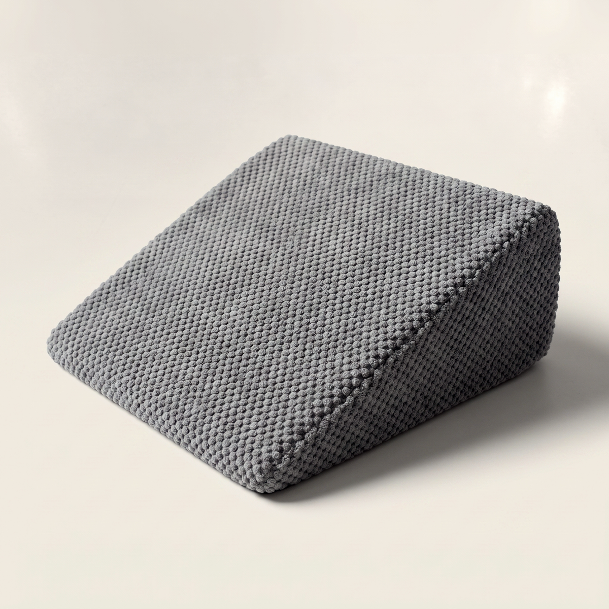 Doxie Guard stair wedge for dachshunds in grey popcorn knit, tapered from a thick bolster end to a thin nose