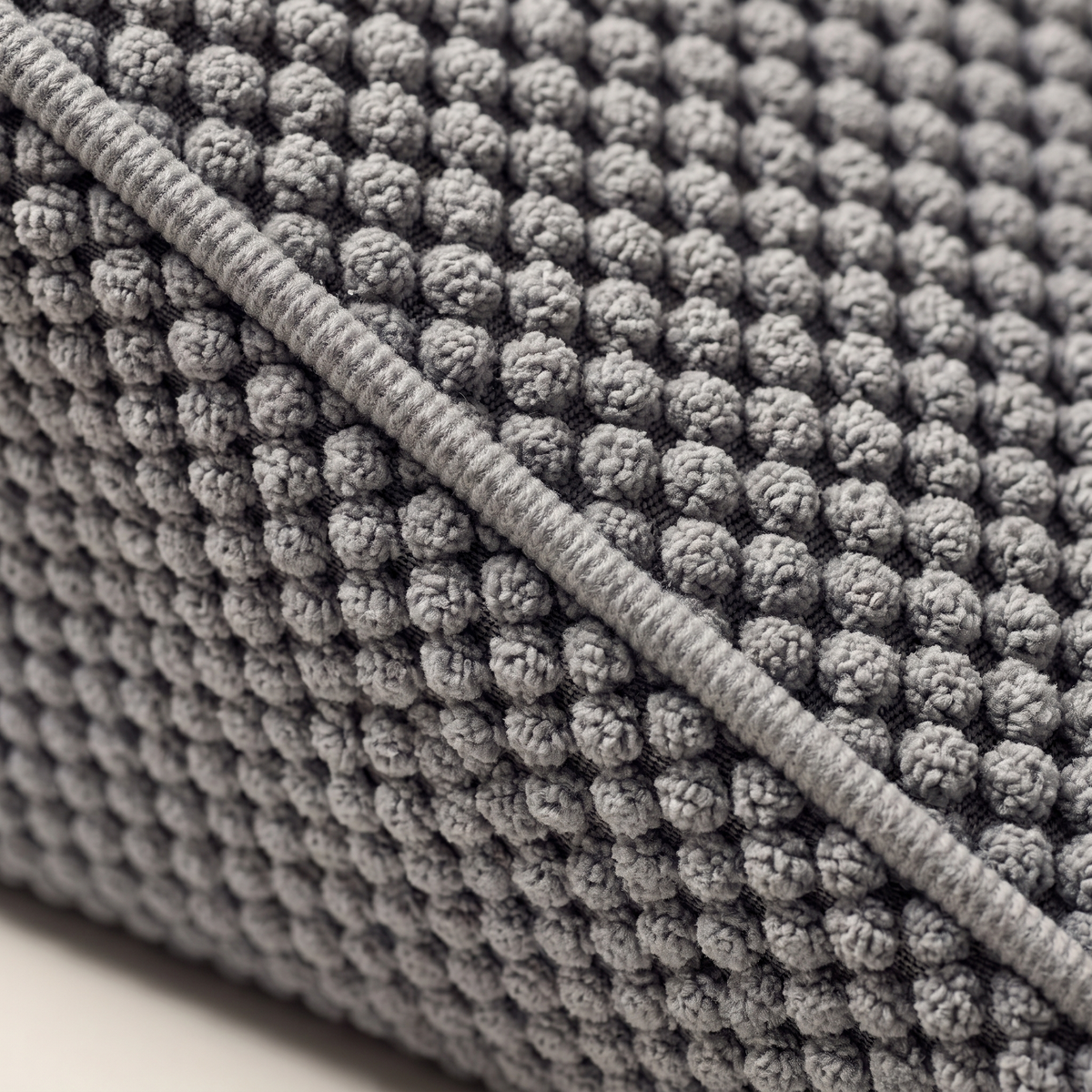 Close up of the popcorn bobble knit and the corded welt on the Doxie Guard stair wedge